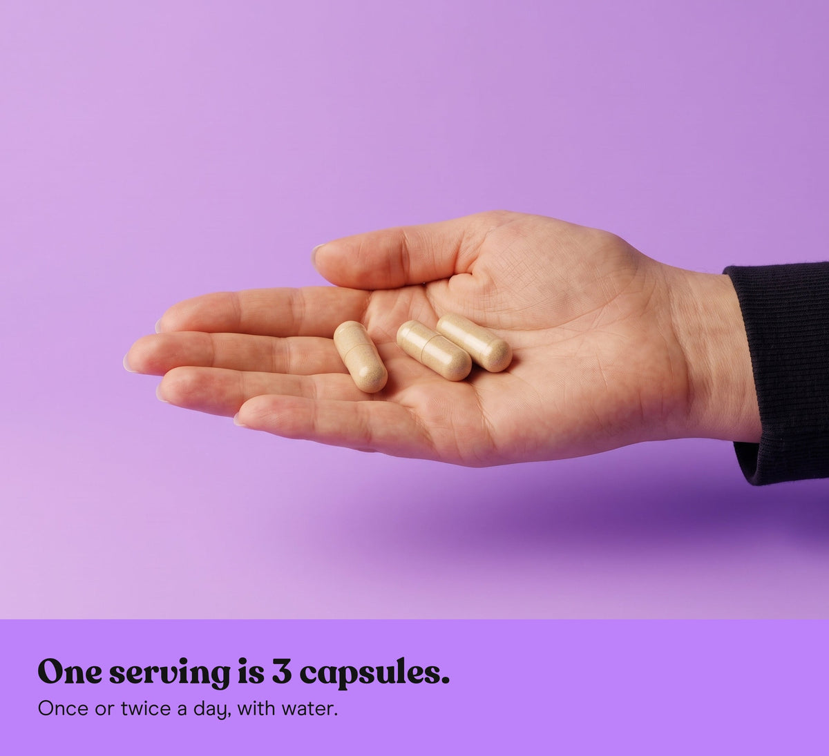 Three Reishi extract capsules in an open hand on a lilac backdrop: one serving is 3 capsules, once or twice a day, with water