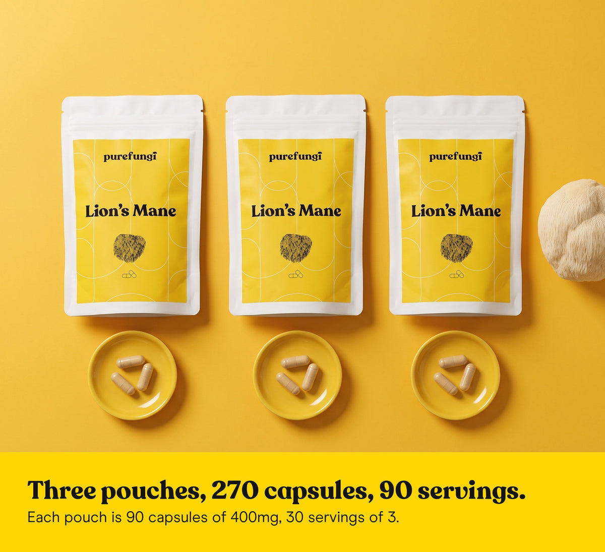 Three Pure Fungi Lion's Mane capsules pouches lying flat, each with a small dish of three capsules, beside a Lion's Mane mushroom on a yellow backdrop